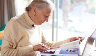 A resident relaxes and reads. Senior living at Generations LLC