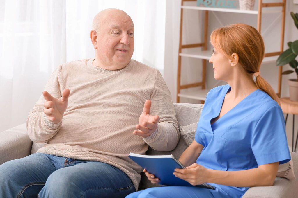 A senior patient talks with a provider, Memory Care in Montrose Colorado